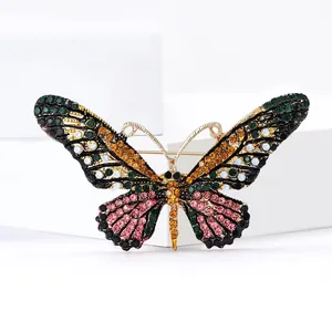 Colorful butterfly brooch with vibrant rhinestones on a gold-plated base for women