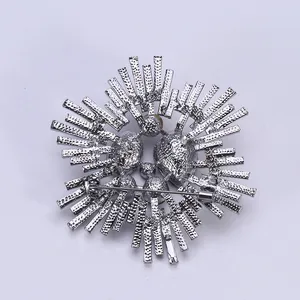Silver retro sunburst brooch with back pin detail and textured alloy plating finish