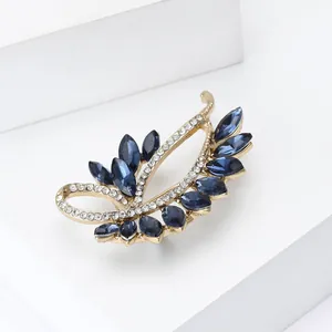 Vintage gold crystal leaf brooch with navy marquise stones and small white diamonds