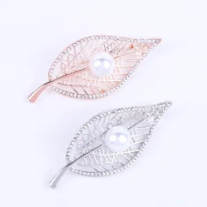 Elegant leaf brooches with sparkling crystals and pearls in silver and rose gold finishes