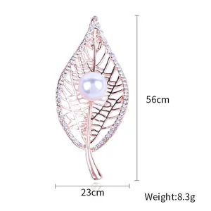 Elegant rose gold leaf brooch with hollow veins, white pearls and sparkling rhinestones