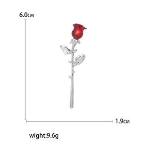 Elegant silver rose brooch with red flower bud including dimensions 6.0cm x 1.9cm
