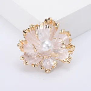 Elegant gold peony flower brooch with pearlescent petals and a large center pearl