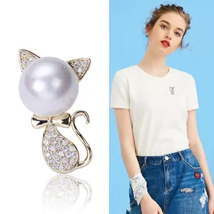 Cute kitten brooch with white pearl and sparkling crystals in a stylish fashion design