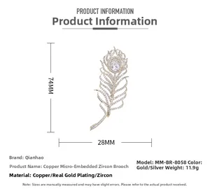 Vue détaillée des dimensions de la broche plume indiquant 74mm x 28mm en or et argent