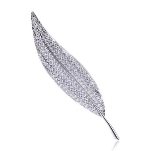 Macro shot of micro-pave leaf brooch with sparkling cubic zirconia on silver metal base