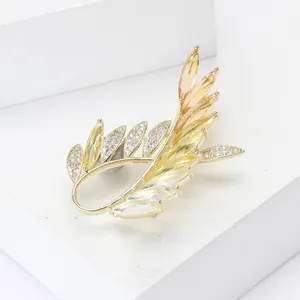 Elegant gold olive branch brooch with micro-paved amber zircons for women suits