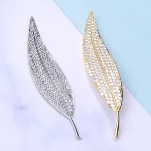 Elegant leaf zircon brooches in gold and silver finish with sparkling micro-pave crystals