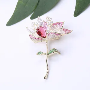 Elegant lotus flower brooch with gradient pink zircon crystals and red gemstone on gold base