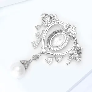 Detail view of the silver brooch back featuring a secure pin clasp and hollow metalwork