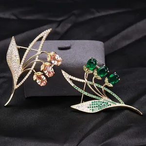 Elegant micro-pasted zircon floral brooch in champagne gold and emerald green designs
