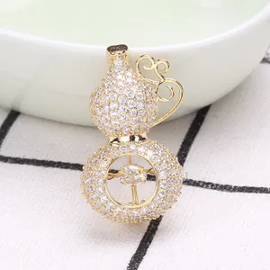 Luxurious gold-plated gourd brooch with micro-pave cubic zirconia and dancing stone