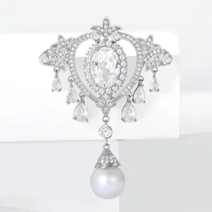 Baroque silver brooch with zircon tassels and a large pearl on geometric blocks