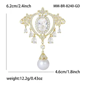 Baroque royal style brooch with oval zircon and white pearl dangle on white background