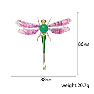 Exquisite enamel dragonfly brooch with purple wings and green gemstone inlay