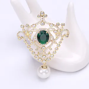 Vintage palace style gold brooch with green zircon stone and pearl drop pendant