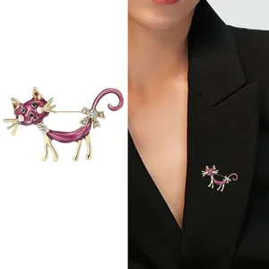 Cartoon enamel cat brooch in purple alloy with rhinestones, shown on white and on model