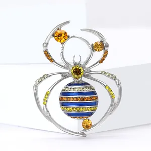 Spider brooch with colorful rhinestones and blue enamel inlay on silver metal base