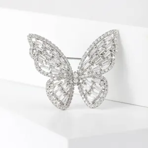 Elegant silver butterfly brooch with cubic zirconia micro-pave on white display
