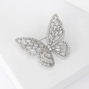 Exquisite silver butterfly brooch with micro-paved cubic zirconia on white background