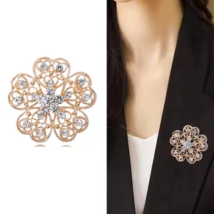 Sparkling gold hollow flower brooch with rhinestone heart petals for women's suits