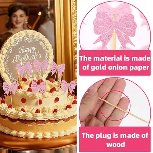 Vue détaillée de décorations de gâteau en nœud rose pailleté avec bâtonnets en bois