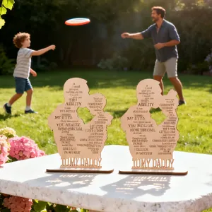 Detail of wooden Father's Day plaque with silhouette art and engraved message on white table