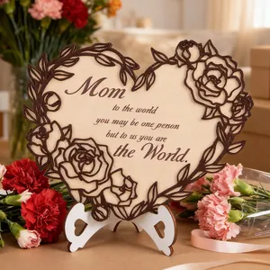 Detail of laser-cut wooden heart plaque with rose border and engraved Mother's Day message