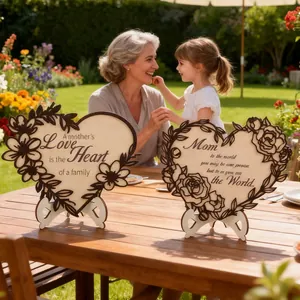 Detail of laser-cut wooden heart plaque with floral edges and warm English quotes