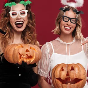 Close-up of funny Halloween bat eyewear with pom-poms and glitter for party costumes