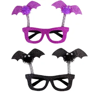 Halloween bat glasses with glitter frames and pom-poms for festive party decoration