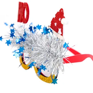 Christmas party glasses with red Santa hat and silver tinsel stars on a white background