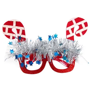 Detail of Santa Claus glasses with silver tinsel and blue metallic star ornaments