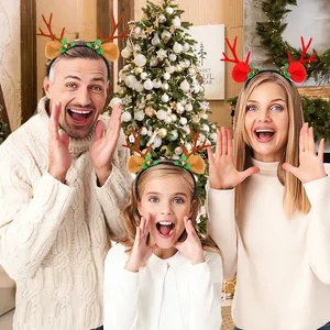 Family wearing Christmas reindeer antler headbands with bells and plush ears in a festive room