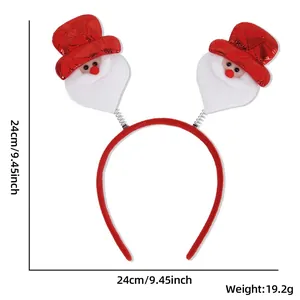 Detail of Christmas headband with spring-loaded Santa Claus figures and red velvet finish