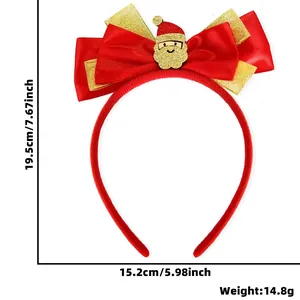 Detail of red Christmas bow headband with golden sequins and Santa Claus ornament