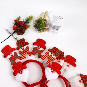 Détails du serre-tête de Noël avec Père Noël et bonhomme de neige avec écharpe