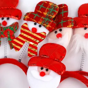 Christmas headband with plush Santa Claus and snowman dolls on festive silver springs
