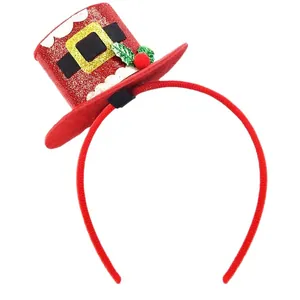 Christmas headband with red glitter mini top hat decorated with green leaves and berries