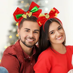 Detail of festive Christmas bow headbands with Santa Claus and golden bells on models