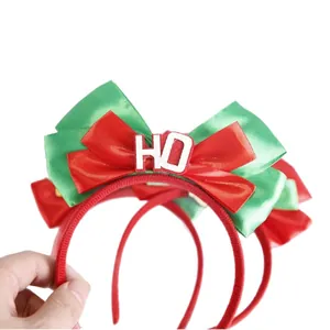Christmas headband with red and green satin bow featuring HO letters for festive party decor