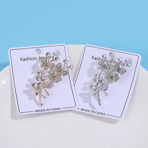 Broches élégantes fleurs papillons serties de strass en tons or et argent