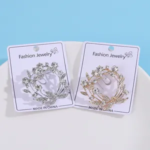 Sprankelende strass olijftak krans broches in zilveren en gouden minimalistische afwerking