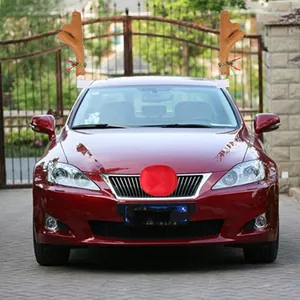 Plush reindeer antlers with bells and red nose kit installed on a red luxury vehicle