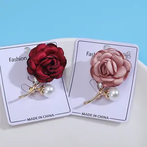 Elegant rose brooches with pearls and rhinestones in red and pink for wedding dresses