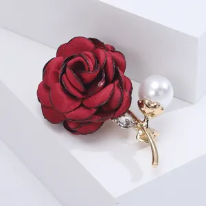 Elegant red fabric rose brooch with gold leaf, sparkling rhinestone and white pearl accent