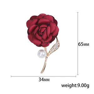 Elegant dark red fabric rose brooch with pearls and rhinestones on gold metal stem