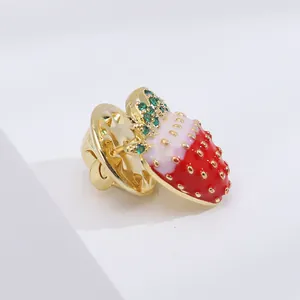Exquisite strawberry brooch with red enamel finish and green cubic zirconia leaves