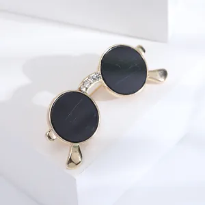 Chic gold-plated round sunglasses brooch with rhinestones and black enamel finish