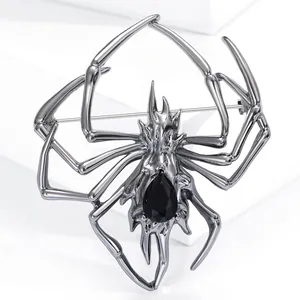 Gothic spider brooch in gunmetal alloy featuring a large black pear-cut gemstone